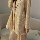 Cekinowy zestaw z marynarką i szerokimi spodniami