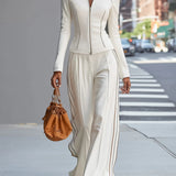 Komplet city chic z taliowaną kurtką i szerokimi spodniami