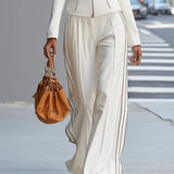 Komplet city chic z taliowaną kurtką i szerokimi spodniami