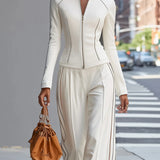 Komplet city chic z taliowaną kurtką i szerokimi spodniami