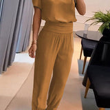 Elegancki komplet z bluzką V-neck i luźnymi spodniami z wysoką talią