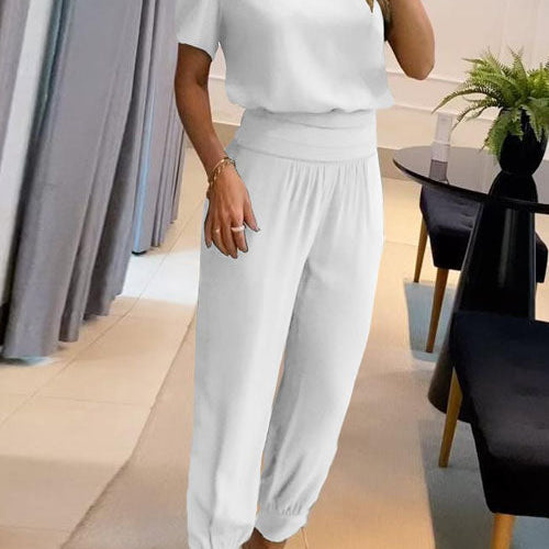 Elegancki komplet z bluzką V-neck i luźnymi spodniami z wysoką talią