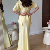 Elegancki komplet z wiązaną bluzką i długą spódnicą