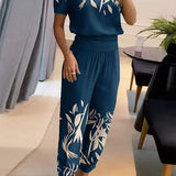 Elegancki komplet z bluzką V-neck i luźnymi spodniami z wysoką talią