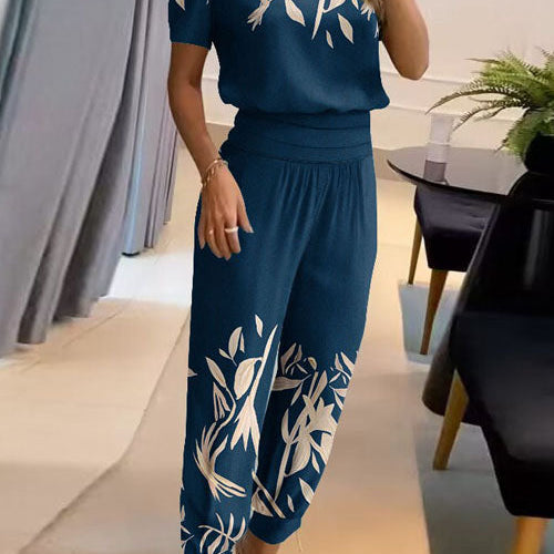 Elegancki komplet z bluzką V-neck i luźnymi spodniami z wysoką talią