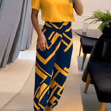 Elegancki komplet z bluzką V-neck i luźnymi spodniami z wysoką talią