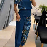 Elegancki komplet z bluzką V-neck i luźnymi spodniami z wysoką talią