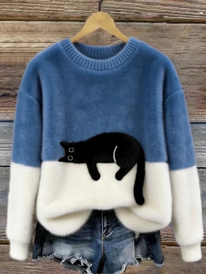 Puszysty sweter oversize z wylegującym się kotem