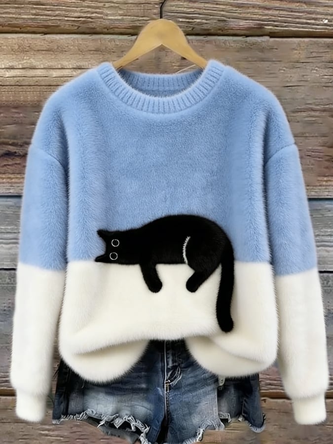 Puszysty sweter oversize z wylegującym się kotem