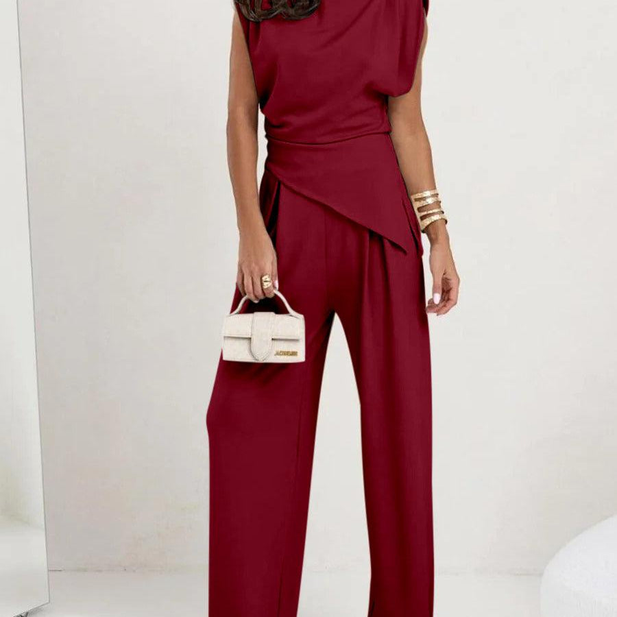 Elegancki komplet z asymetryczną bluzką i szerokimi spodniami