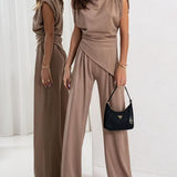 Elegancki komplet z asymetryczną bluzką i szerokimi spodniami