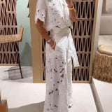 Koronkowy komplet z haftem i szerokimi spodniami z wysokim stanem