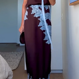 Elegancka spódnica midi z koronkowym wykończeniem