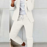 Czarny elegancki komplet z taliowaną marynarką i dopasowanymi spodniami ze sznurkiem