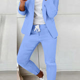 Czarny elegancki komplet z taliowaną marynarką i dopasowanymi spodniami ze sznurkiem