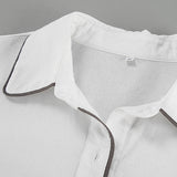 Elegancki komplet z koszulą i szortami z kontrastową lamówką