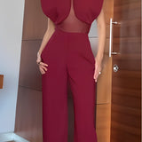 Elegancki bordowy kombinezon z transparentnym panelem