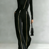 Elegancki komplet czarny z asymetrycznym dekoltem i złotymi zamkami