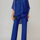 Elegancki zestaw z asymetryczną, warstwową bluzką i szerokimi spodniami z wysokim stanem