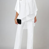 Elegancki zestaw z asymetryczną, warstwową bluzką i szerokimi spodniami z wysokim stanem