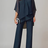 Elegancki zestaw z asymetryczną, warstwową bluzką i szerokimi spodniami z wysokim stanem