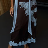 Elegancka spódnica midi z koronkowym wykończeniem