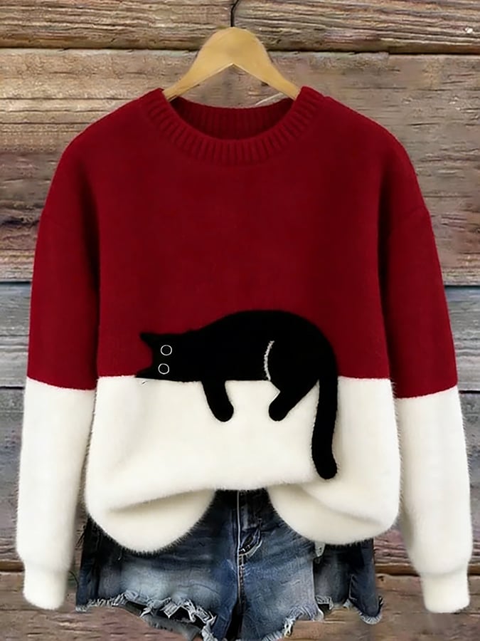 Puszysty sweter oversize z wylegującym się kotem