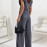 Elegancki komplet z asymetryczną bluzką i szerokimi spodniami