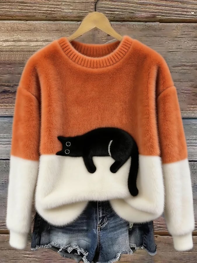 Puszysty sweter oversize z wylegującym się kotem