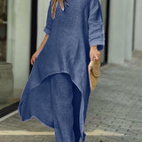 Zwiewny komplet z asymetryczną tuniką i szerokimi spodniami