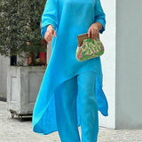 Zwiewny komplet z asymetryczną tuniką i szerokimi spodniami